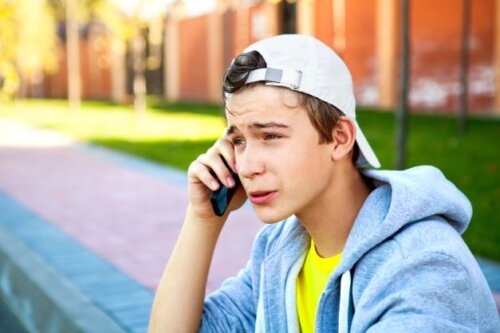 Anxious Teen Boy Adobe On Phone